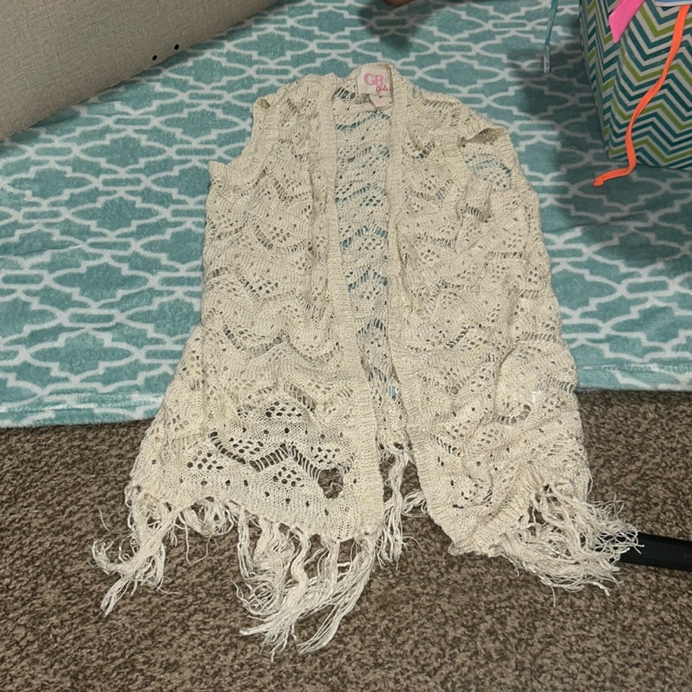 Goes over a white long tank top